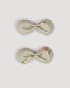 Early Sunday, Penelope Clip in Ditsy Bouquet Jade print, made from Printed Viscose Twill fabric, featuring a set of two bow clips with a secure fit, shown in a front flat-lay view