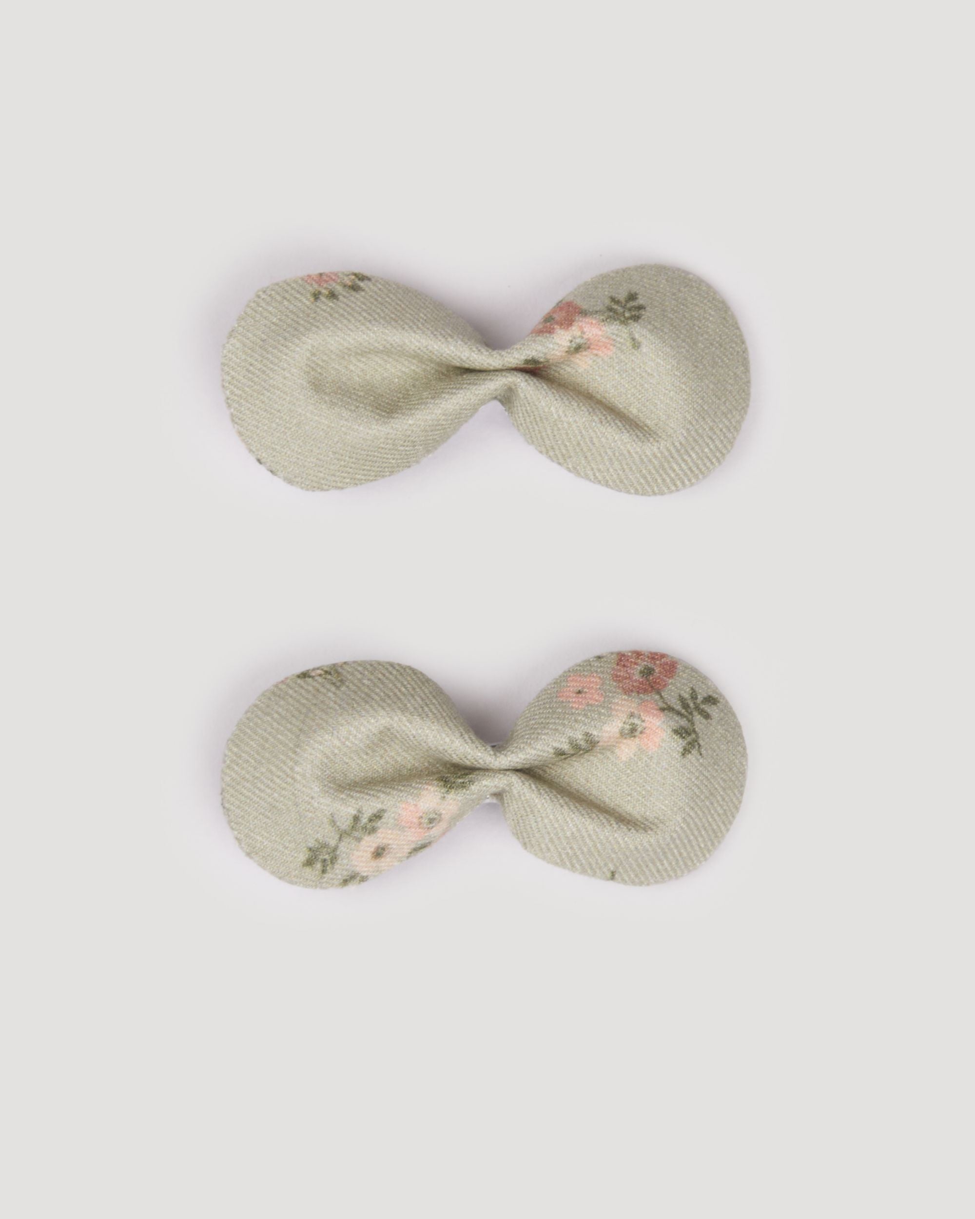 Early Sunday, Penelope Clip in Ditsy Bouquet Jade print, made from Printed Viscose Twill fabric, featuring a set of two bow clips with a secure fit, shown in a front flat-lay view