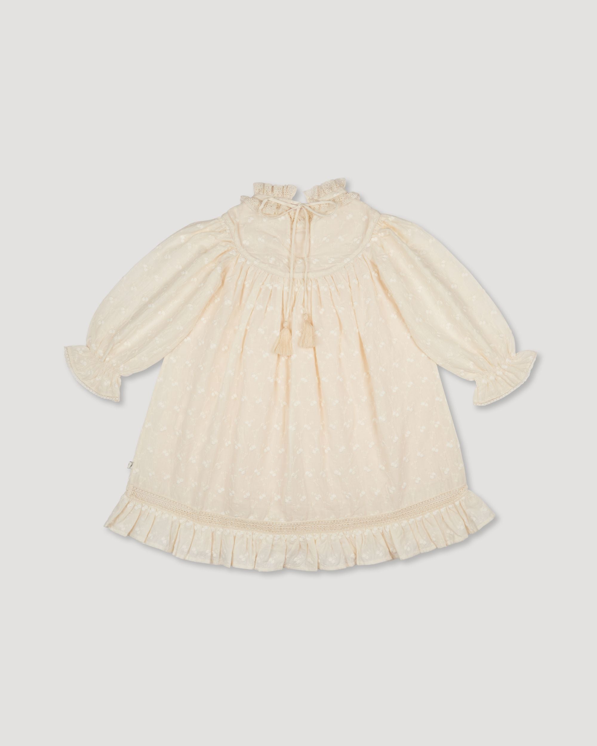 Early Sunday, Penelope Dress in Hazelnut Cream, made from All-Over Embroidered Cotton Cambric fabric, featuring Hand-embroidered floral motifs, shown in a back flat-lay view