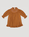 Early Sunday, Penelope Dress in Almond, made from Dyed Cotton Double Gauze fabric, featuring Hand-embroidered floral motifs, shown in a front flat-lay view