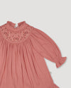 Early Sunday, Penelope Dress in Rose, made from Dyed Cotton Double Gauze fabric, featuring Hand-embroidered floral motifs, shown in a closeup flat-lay view