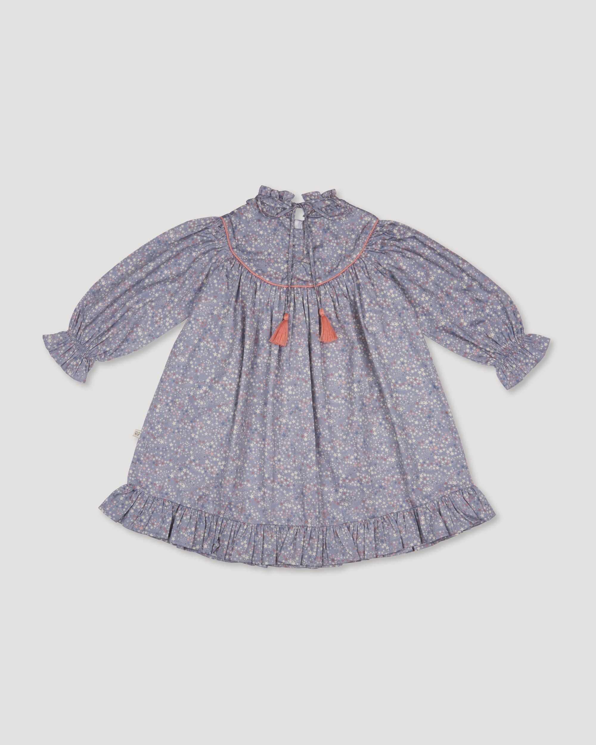 Early Sunday, Penelope Dress in Celestial print, made from Printed Cotton Satin fabric, featuring Hand-embroidered floral motifs, shown in a back flat-lay view