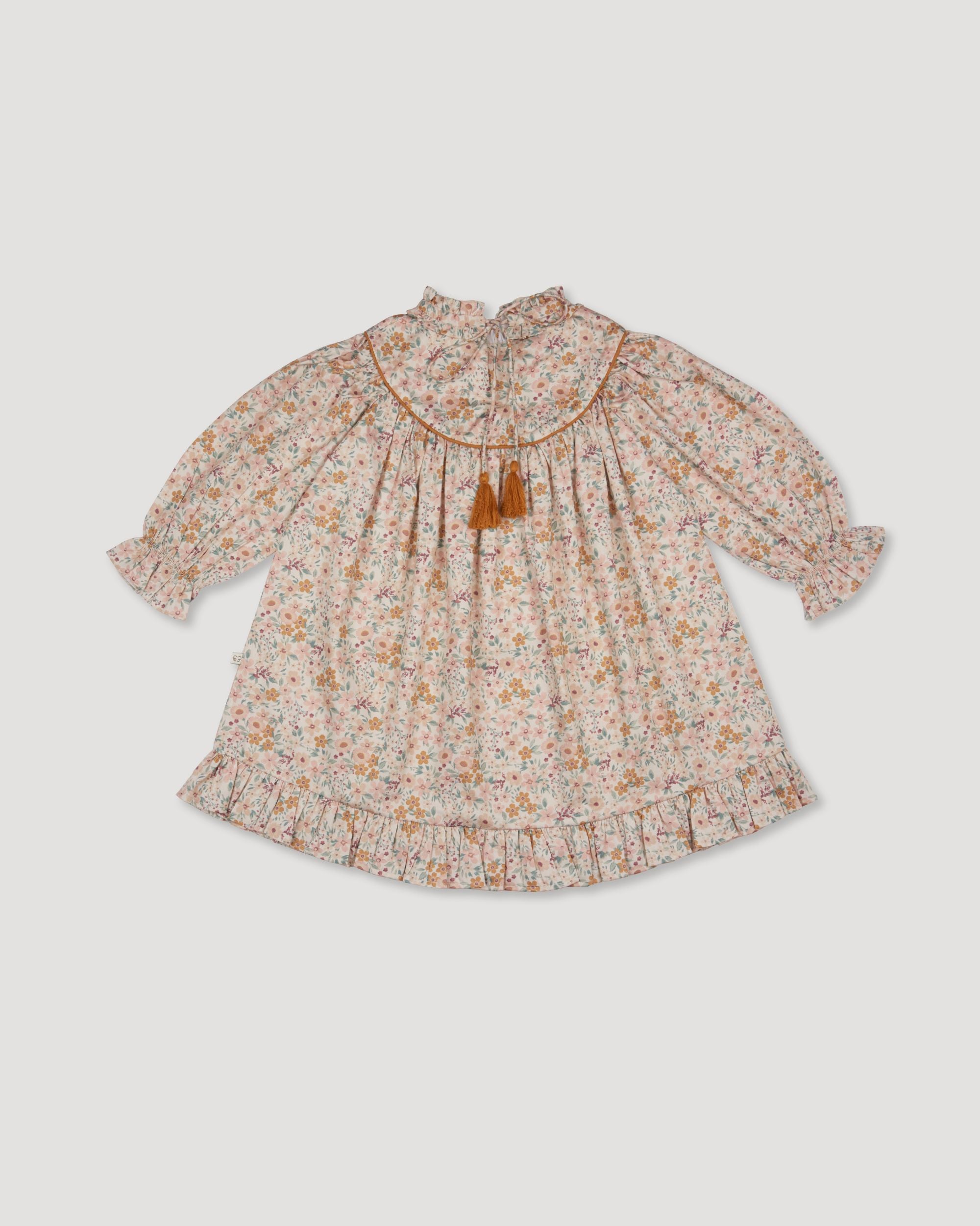 Early Sunday, Penelope Dress in Floral print, made from Printed Cotton Satin fabric, featuring Hand-embroidered floral motifs, shown in a back flat-lay view