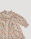 Early Sunday, Penelope Dress in Floral print, made from Printed Cotton Satin fabric, featuring Hand-embroidered floral motifs, shown in a closeup flat-lay view