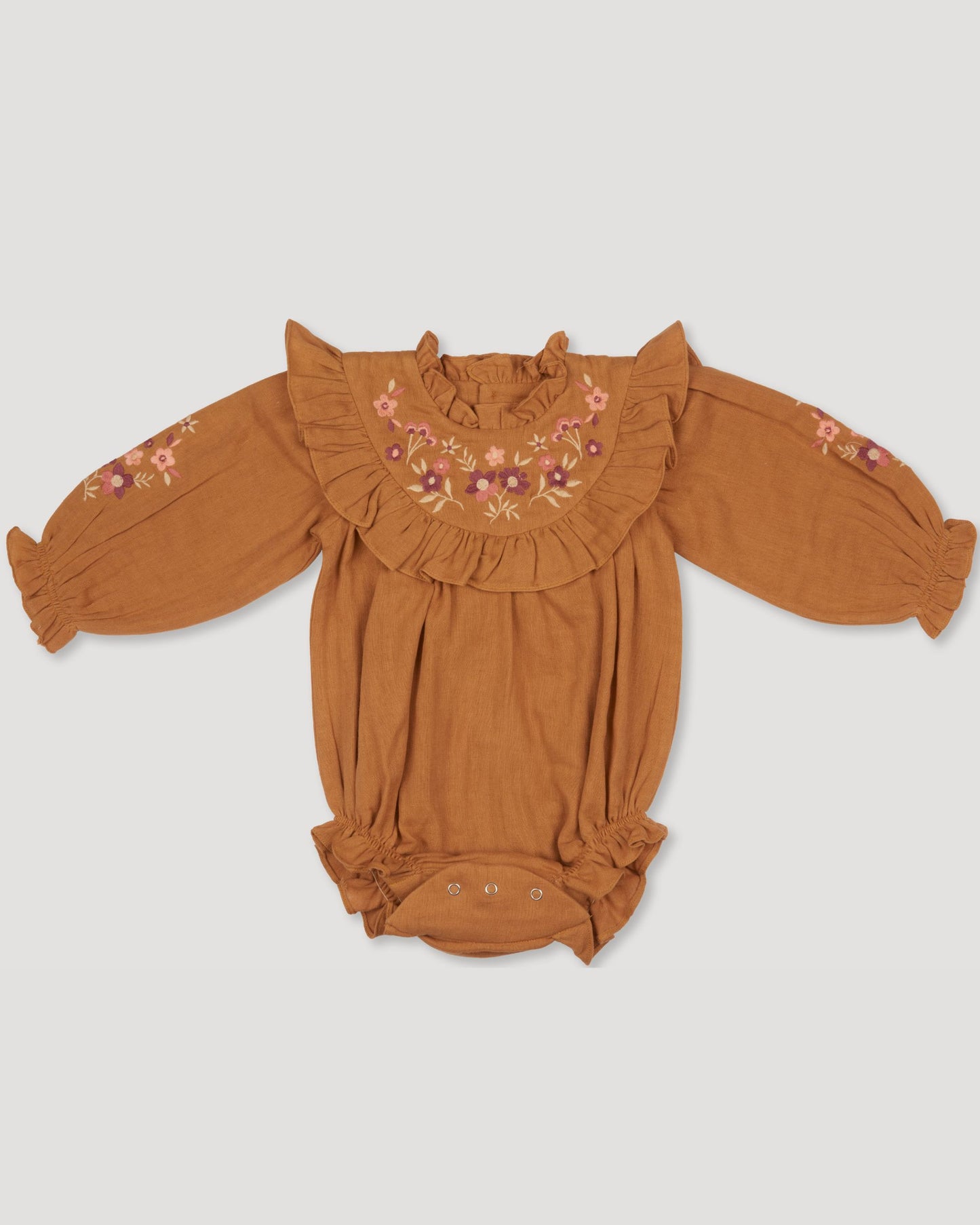 Early Sunday, Pippa Baby Bubble Romper in Almond color, made from Dyed Cotton Double Gauze fabric, featuring beautiful embroidery with frilly neck, shown in a front flat-lay view