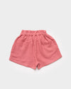 Early Sunday, Roman Cotton Linen Dyed Fabric Short in Peony color, made from 70% Cotton 30% Linen fabric, featuring a relaxed silhouette with a comfortable elastic waistband, shown in a back flat-lay view