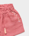 Early Sunday, Roman Cotton Linen Dyed Fabric Short in Peony color, made from 70% Cotton 30% Linen fabric, featuring a relaxed silhouette with a comfortable elastic waistband, shown in a closeup flat-lay view