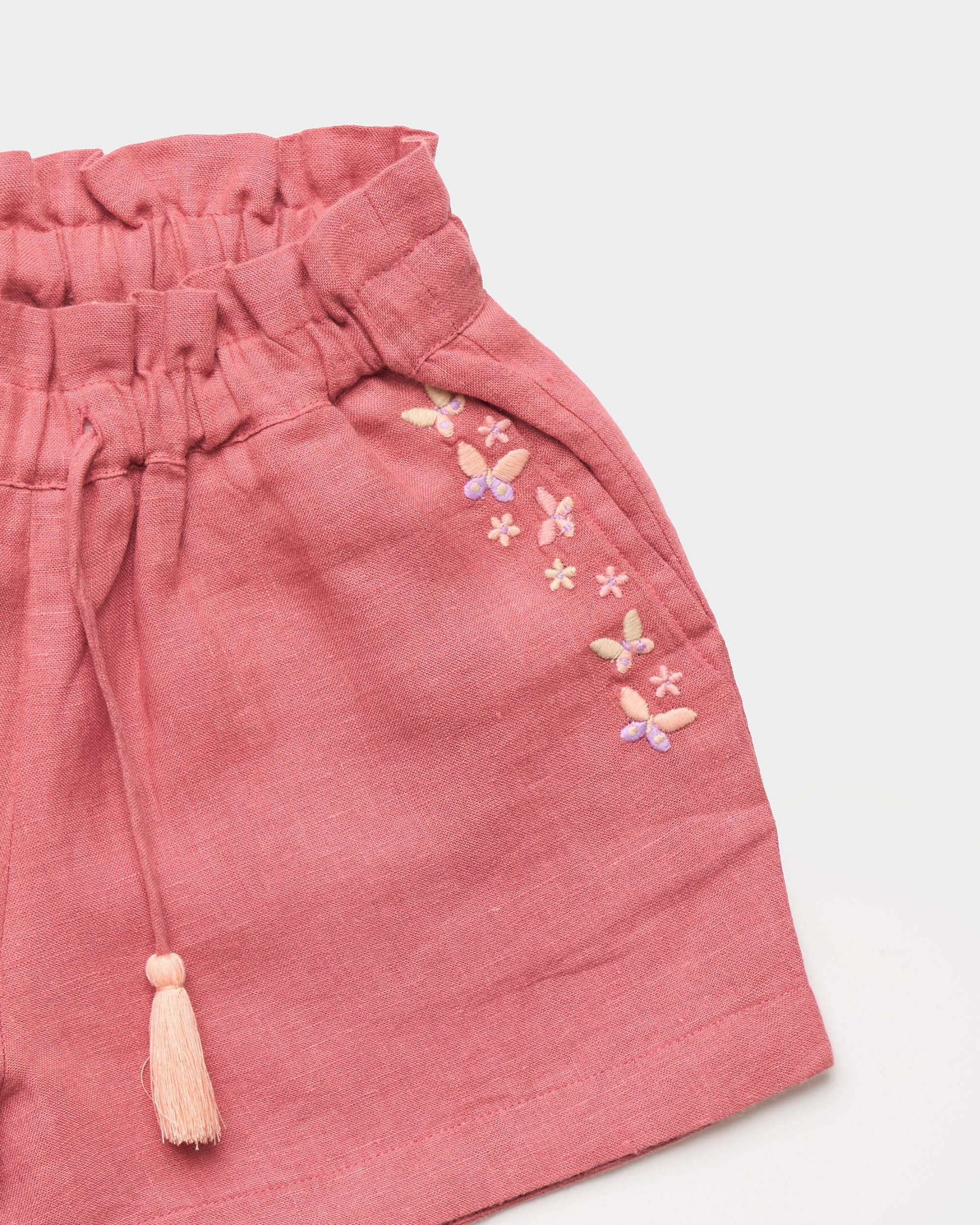 Early Sunday, Roman Cotton Linen Dyed Fabric Short in Peony color, made from 70% Cotton 30% Linen fabric, featuring a relaxed silhouette with a comfortable elastic waistband, shown in a closeup flat-lay view