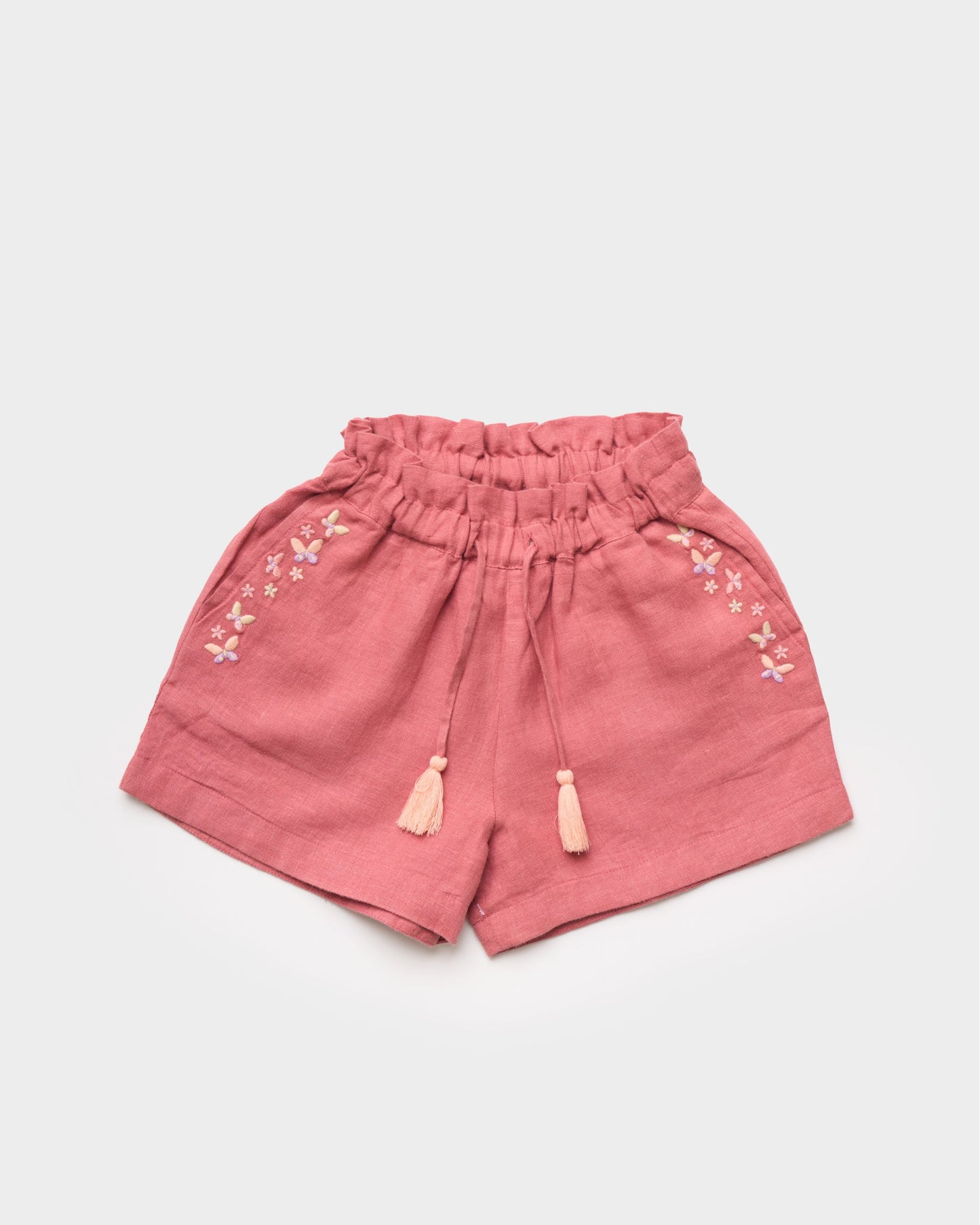 Early Sunday, Roman Cotton Linen Dyed Fabric Short in Peony color, made from 70% Cotton 30% Linen fabric, featuring a relaxed silhouette with a comfortable elastic waistband, shown in a front flat-lay view