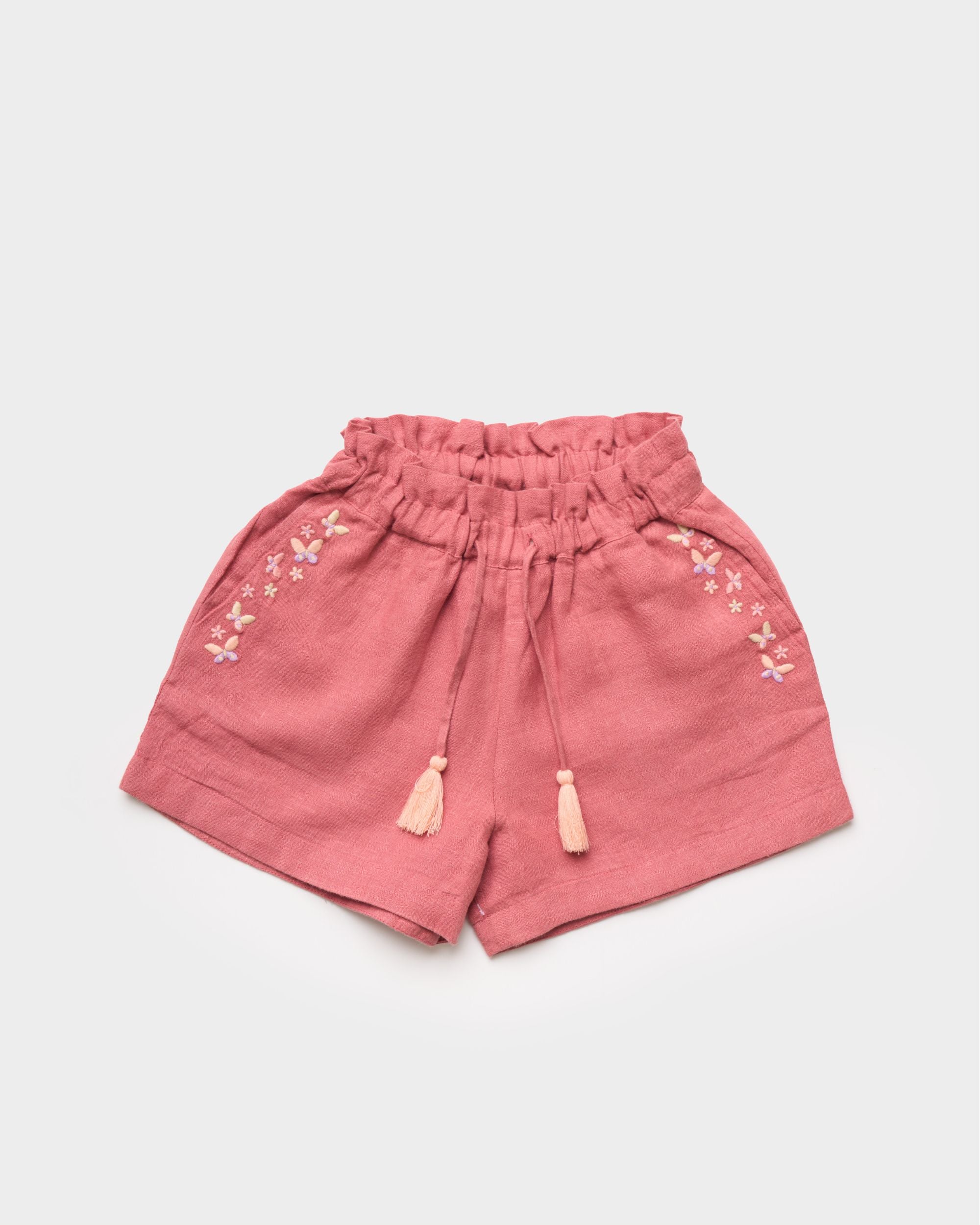Early Sunday, Roman Cotton Linen Dyed Fabric Short in Peony color, made from 70% Cotton 30% Linen fabric, featuring a relaxed silhouette with a comfortable elastic waistband, shown in a front flat-lay view
