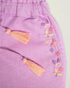 Early Sunday, Roman Short in Lilac color, made from 70% Cotton 30% Linen fabric, featuring a relaxed fit with an elastic waistband & beautiful embroidery, shown in a closeup flat-lay view