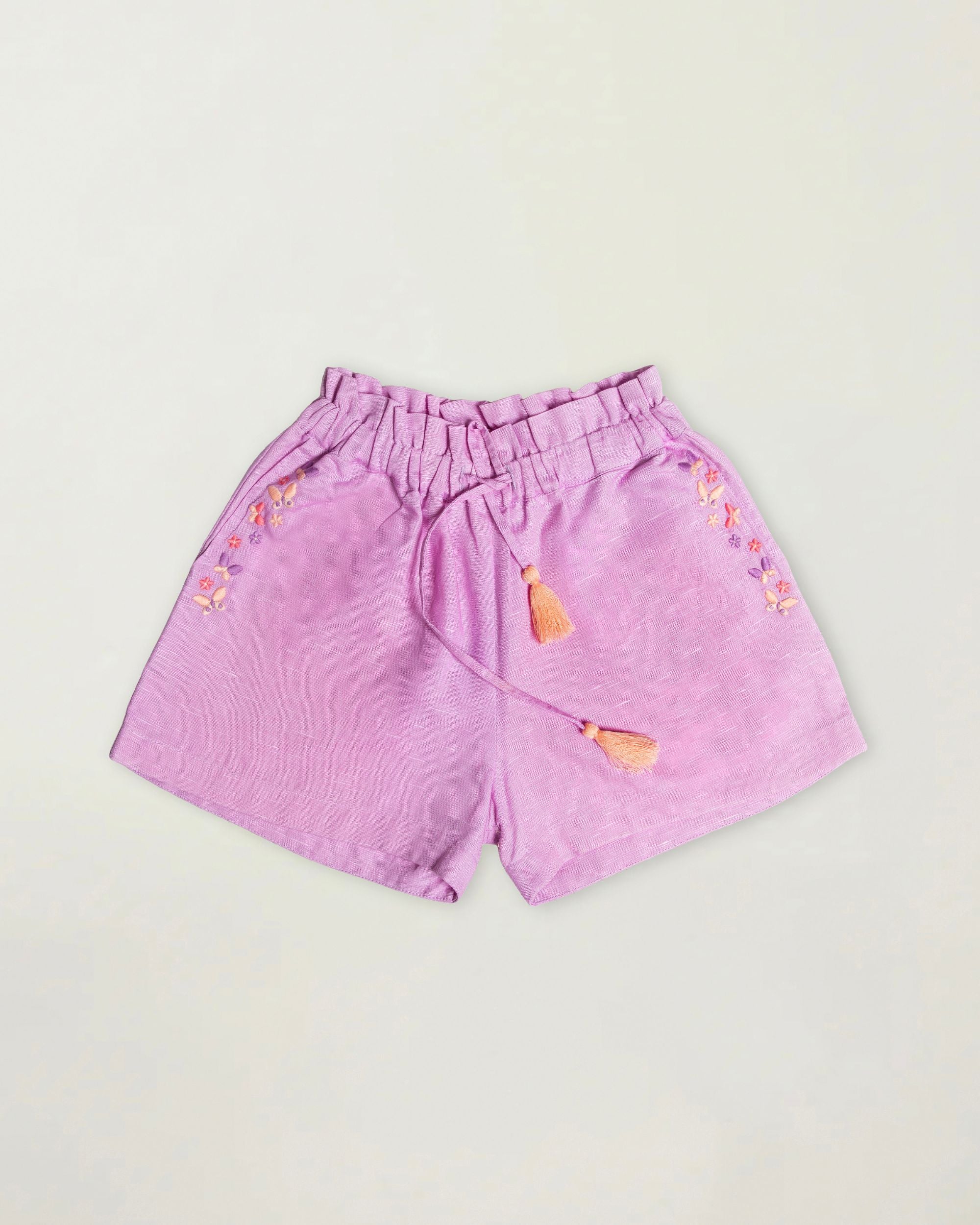 Early Sunday, Roman Short in Lilac color, made from 70% Cotton 30% Linen fabric, featuring a relaxed fit with an elastic waistband & beautiful embroidery, shown in a front flat-lay view