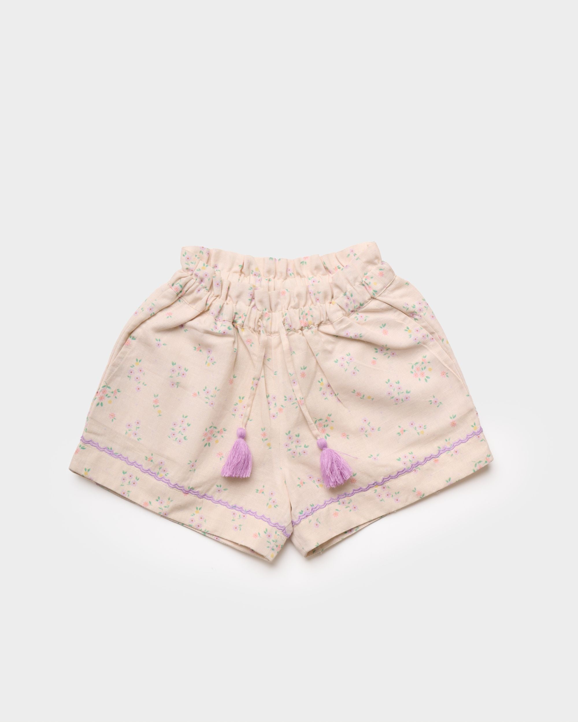 Early Sunday, Roman Short in Painted Bouquet print, made from 70% Cotton 30% Linen fabric, featuring a relaxed fit with an elastic waistband & floral design, shown in a front flat-lay view