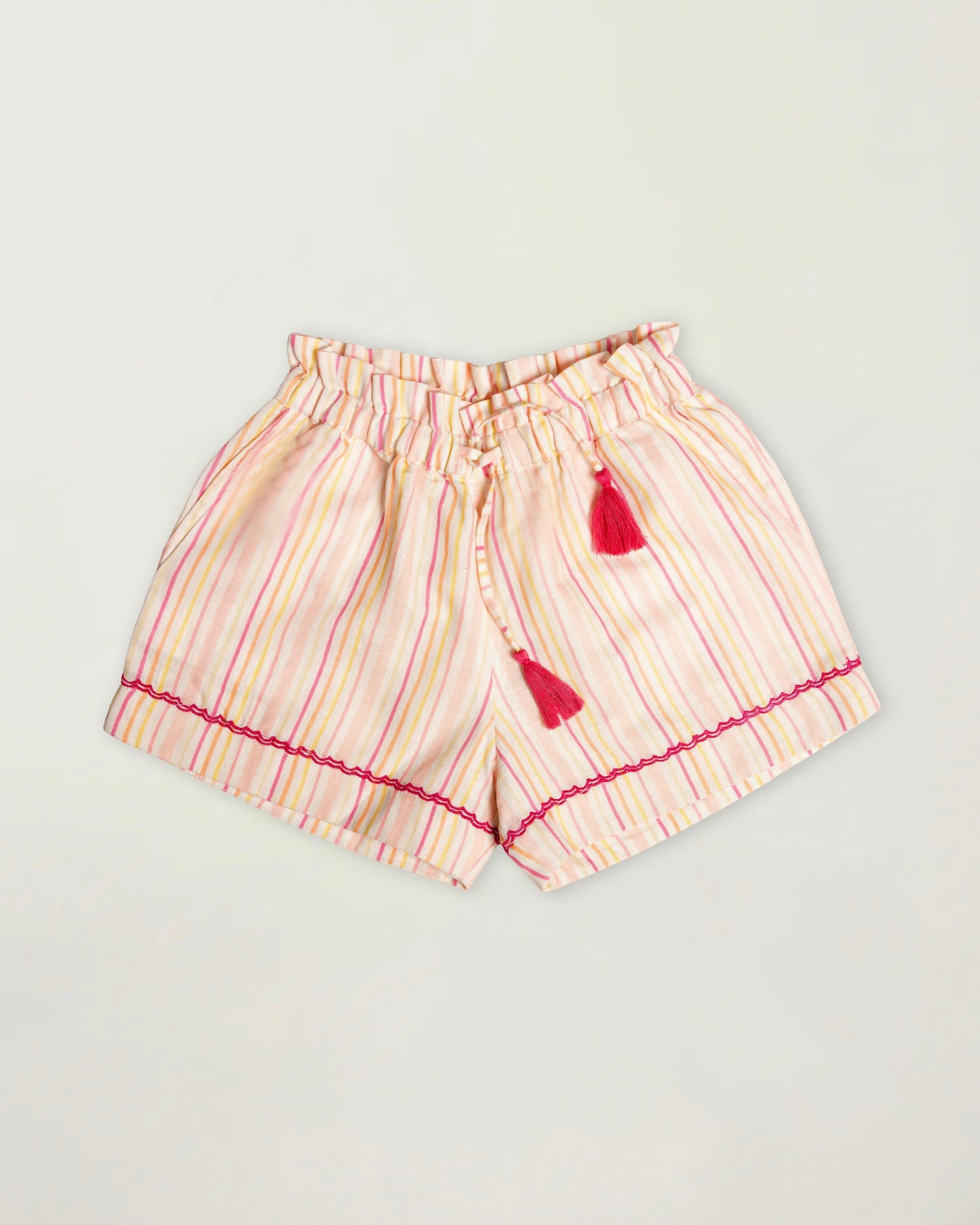 Early Sunday, Roman Short in Pink Strips print, made from 70% Cotton 30% Linen fabric, featuring a relaxed fit with an elastic waistband & striped design, shown in a front flat-lay view