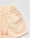 Early Sunday, Roman Short in Sand color, made from 70% Cotton 30% Linen fabric, featuring a relaxed fit with an elastic waistband & beautiful embroidery, shown in a closeup flat-lay view