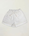 Early Sunday, Roman Short in Ivory color, made from All Over Embroidery fabric, featuring a relaxed fit with an elastic waistband & beautiful embroidery, shown in a front flat-lay view