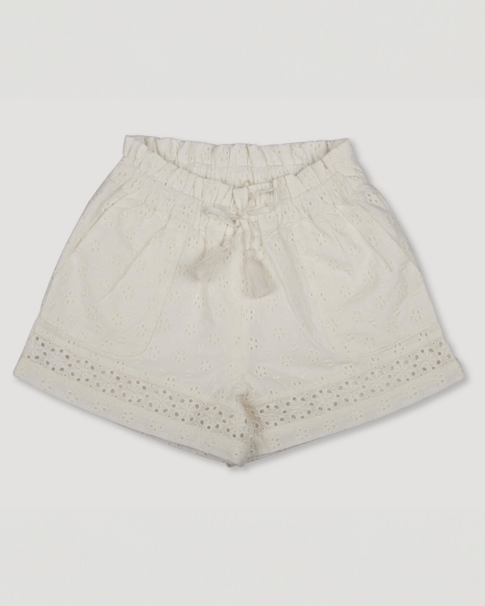 Early Sunday, Roman Shorts in Ivory color, made from All-Over Eyelet Embroidered Cotton Schifflie fabric, featuring relaxed fit with delicate finishes, combining style and functionality, shown in a front flat-lay view