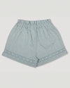 Early Sunday, Roman Shorts in Sea Dream color, made from All-Over Eyelet Embroidered Cotton Schifflie fabric, featuring relaxed fit with delicate finishes, combining style and functionality, shown in a back flat-lay view