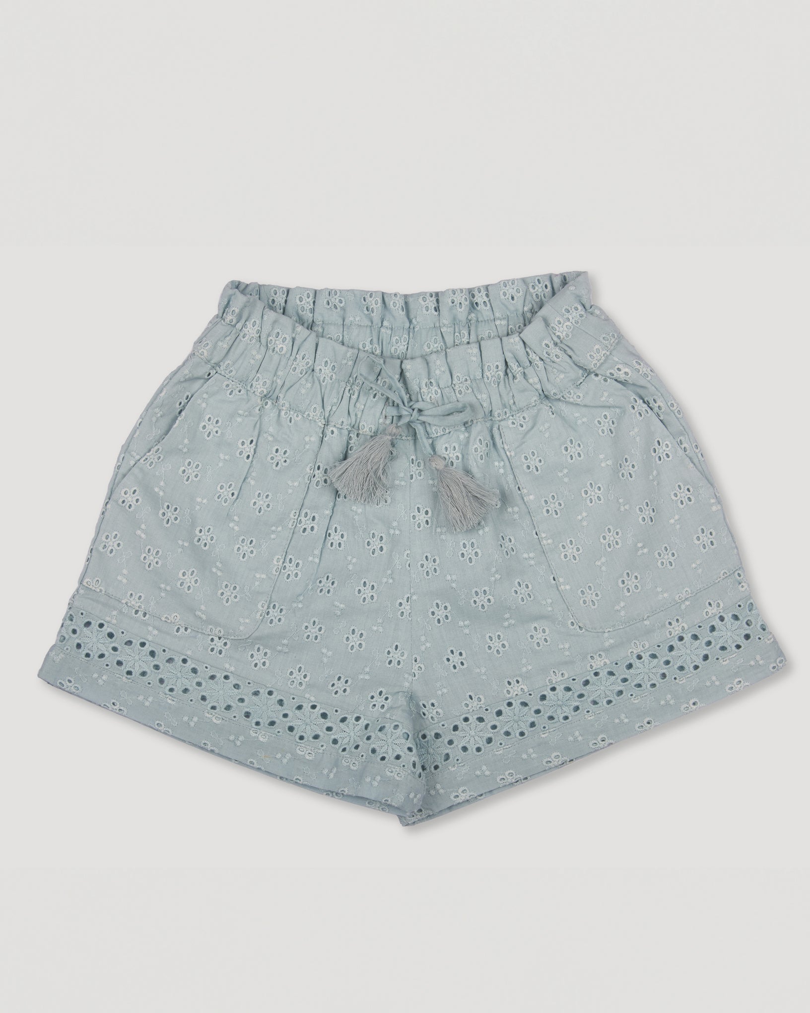 Early Sunday, Roman Shorts in Sea Dream color, made from All-Over Eyelet Embroidered Cotton Schifflie fabric, featuring relaxed fit with delicate finishes, combining style and functionality, shown in a front flat-lay view