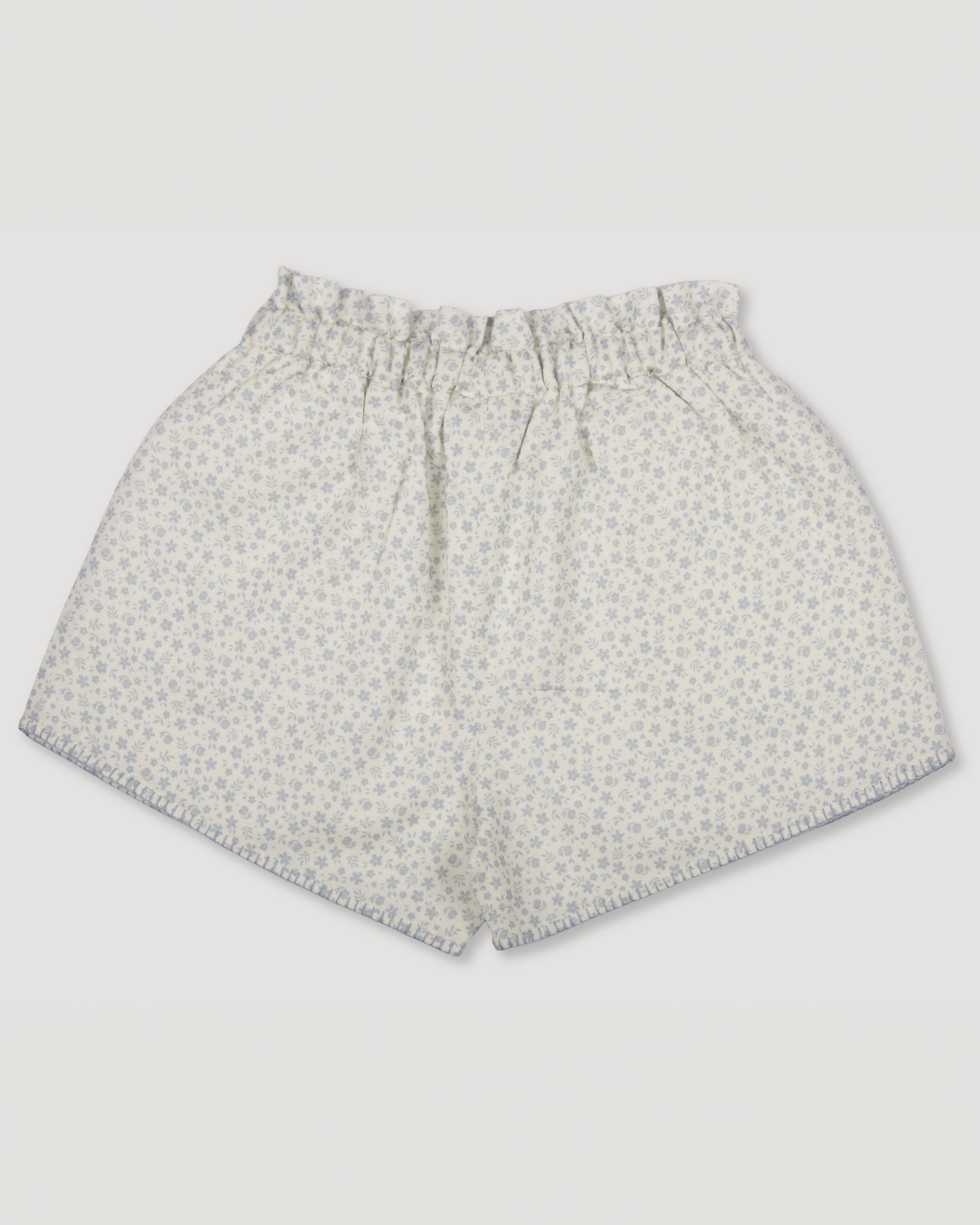 Early Sunday, Roman Shorts in Mini Flower print, made from Printed canvas 70% Cotton 30% Linen fabric, featuring relaxed fit with delicate finishes, combining style and functionality, shown in a back flat-lay view
