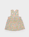 Early Sunday, Romy Blouse in Emma Floral Mint color, made from Organic Printed 60s Cotton Cambric fabric, featuring a sleeveless design with cross-back straps, a gathered waist & a soft flared silhouette, shown in a back flat-lay view