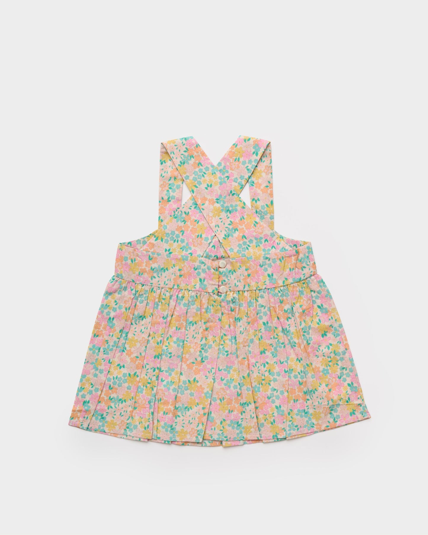 Early Sunday, Romy Blouse in Emma Floral Mint color, made from Organic Printed 60s Cotton Cambric fabric, featuring a sleeveless design with cross-back straps, a gathered waist & a soft flared silhouette, shown in a back flat-lay view
