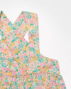 Early Sunday, Romy Blouse in Emma Floral Mint color, made from Organic Printed 60s Cotton Cambric fabric, featuring a sleeveless design with cross-back straps, a gathered waist & a soft flared silhouette, shown in a closeup flat-lay view