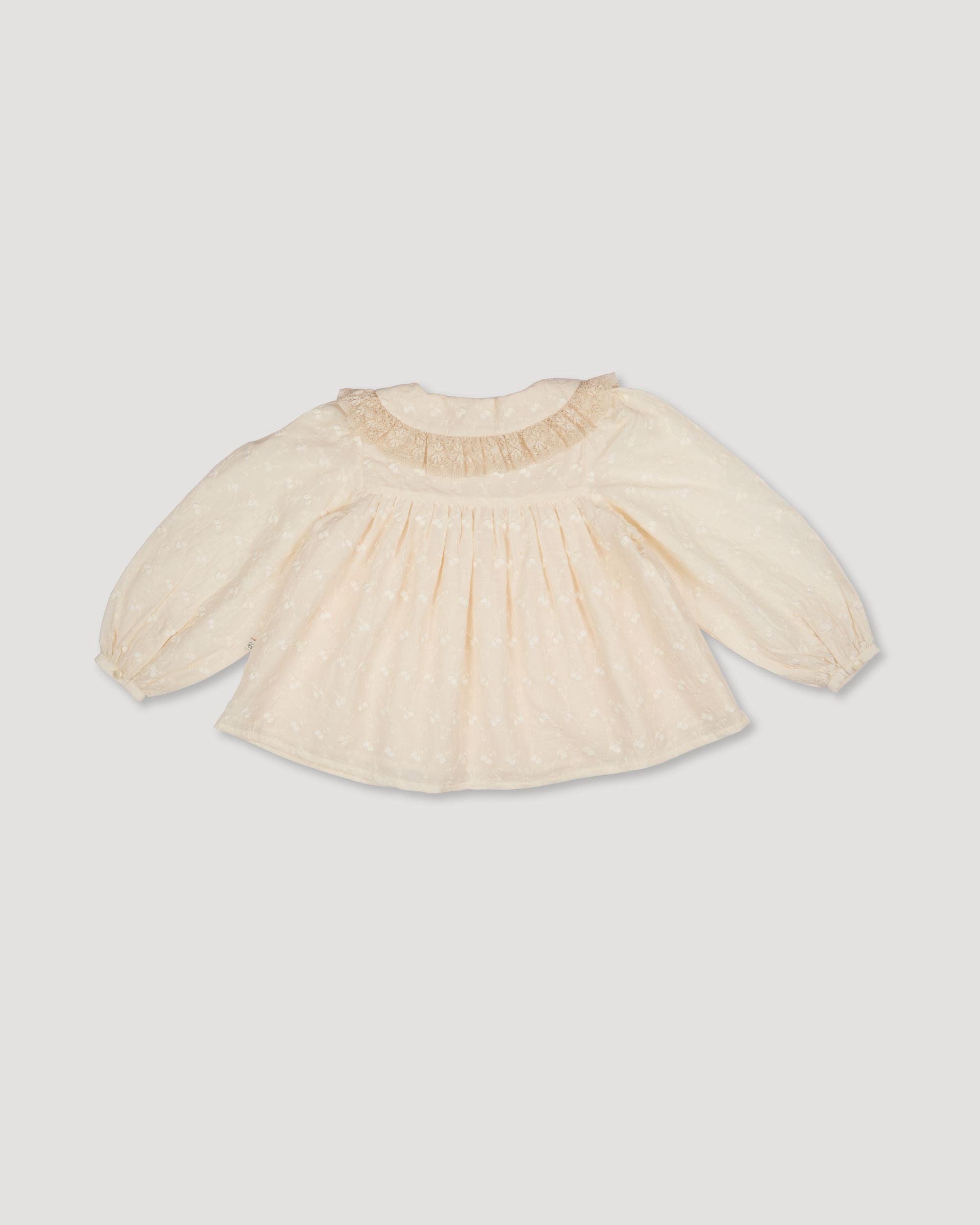 Early Sunday, Rosa Blouse in Hazelnut Cream, made from All-Over Embroidered Cotton Cambric fabric, featuring Frilled neckline detailed with a lace collar for a vintage touch, shown in a back flat-lay view