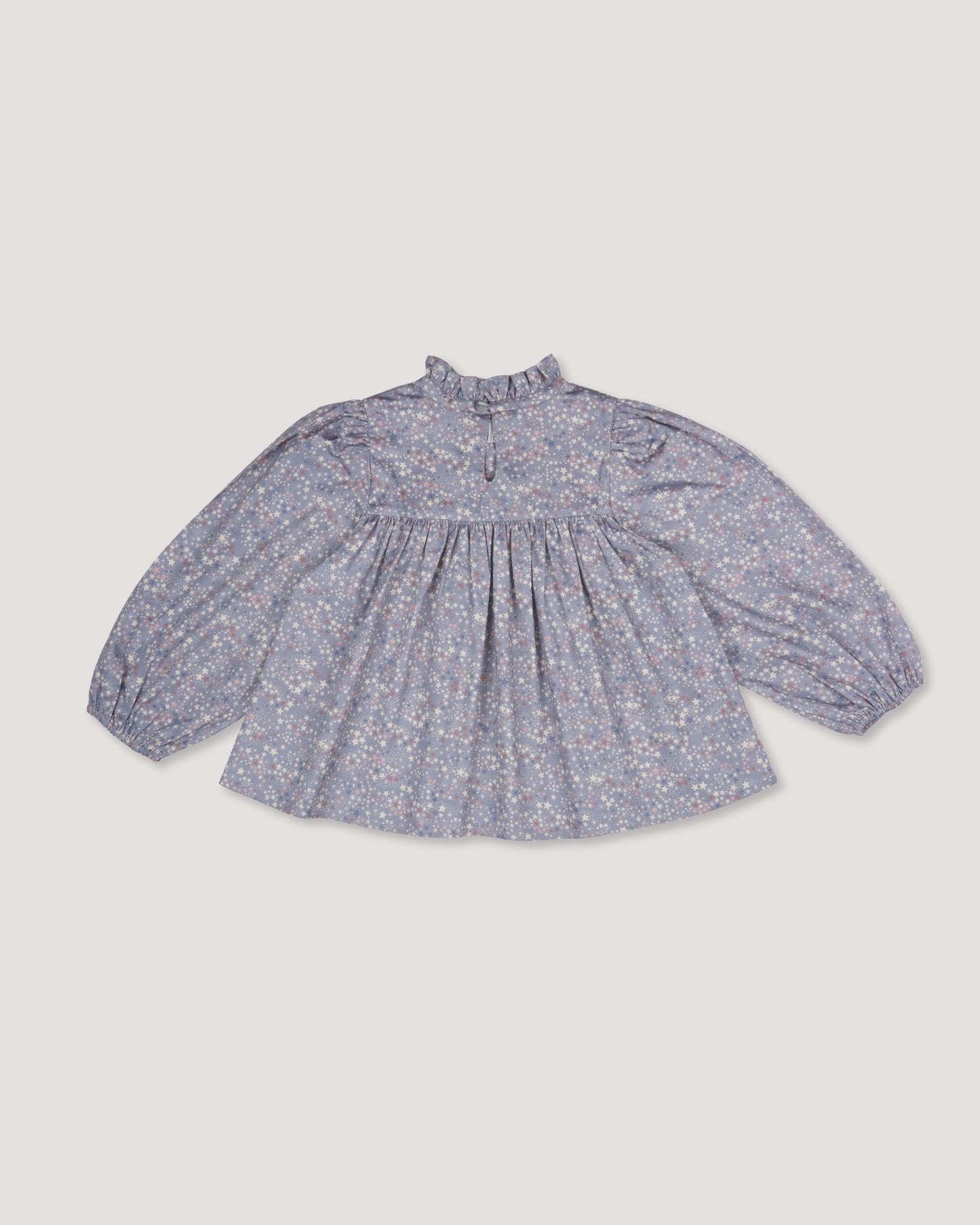 Early Sunday, Rosa Blouse in Celestial print, made from Printed Cotton Satin fabric, featuring Frilled neckline detailed with a lace collar for a vintage touch, shown in a back flat-lay view