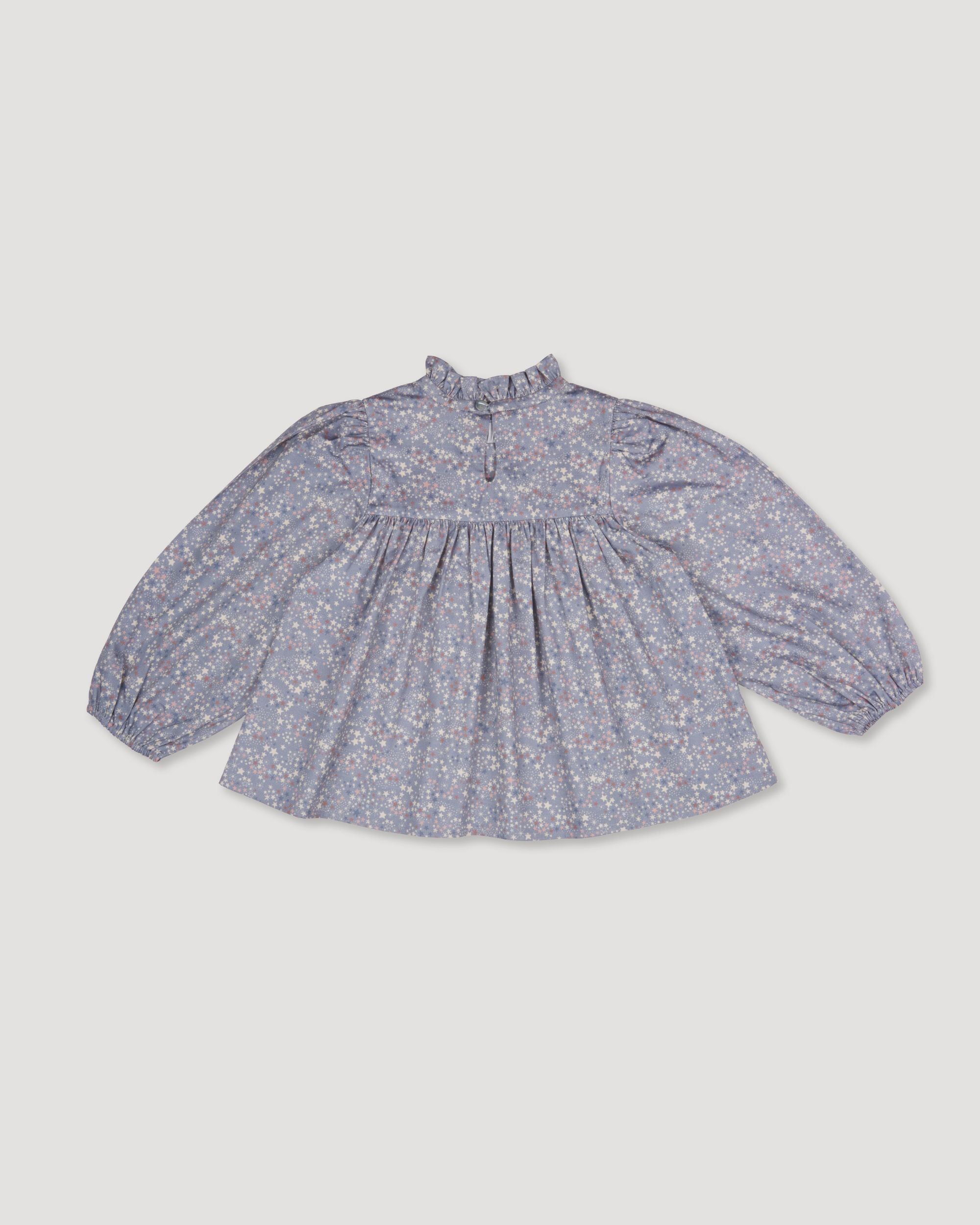 Early Sunday, Rosa Blouse in Celestial print, made from Printed Cotton Satin fabric, featuring Frilled neckline detailed with a lace collar for a vintage touch, shown in a back flat-lay view