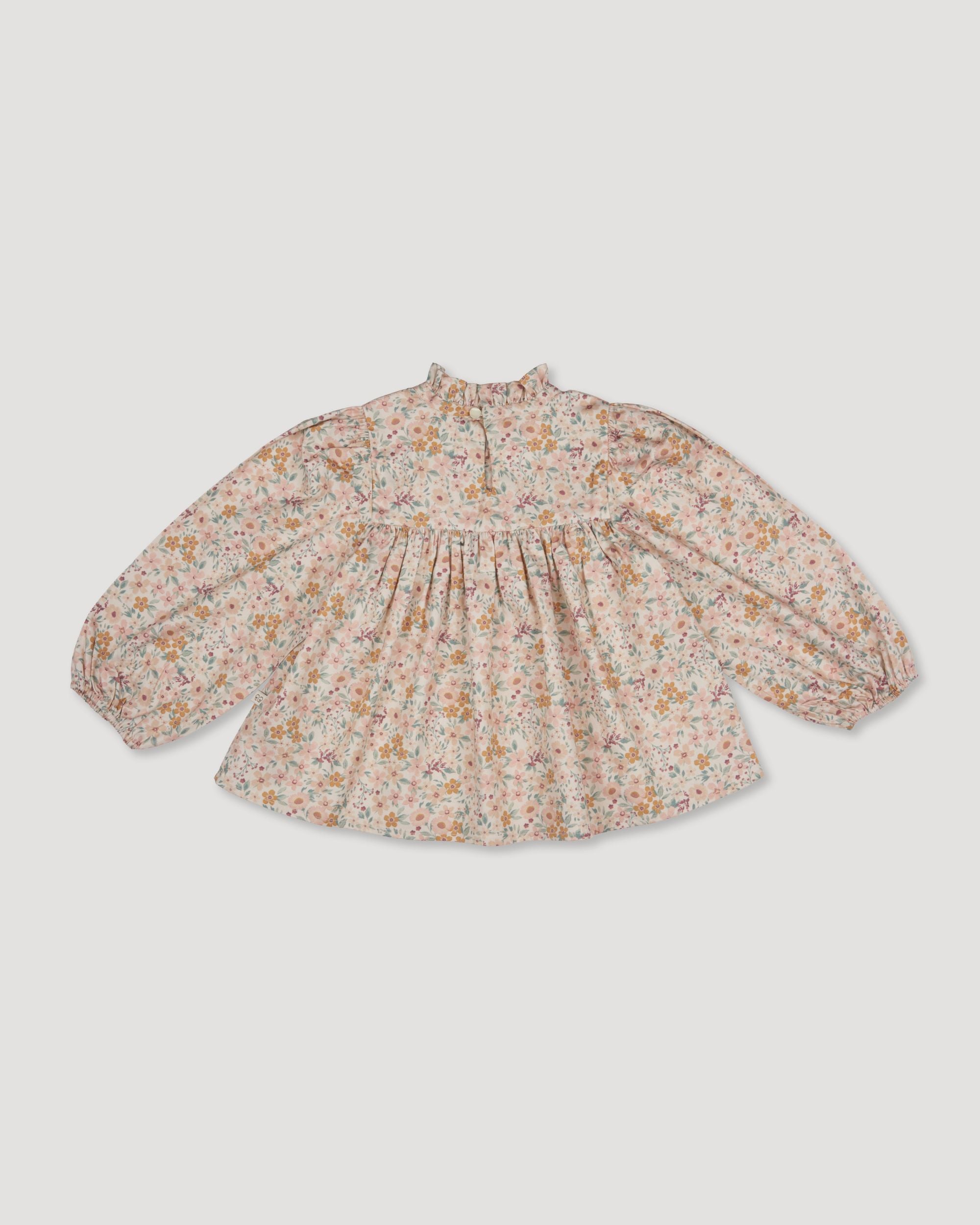 Early Sunday, Rosa Blouse in Floral print, made from Printed Cotton Satin fabric, featuring Frilled neckline detailed with a lace collar for a vintage touch, shown in a back flat-lay view