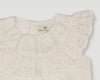 Early Sunday, Rose Baby Bubble Romper in Ivory color, made from All-Over Eyelet Embroidered Cotton Schifflie fabric, featuring gathered bubble silhouette for a cute and comfortable fit, with a relaxed design that allows for ease of movement, shown in a closeup flat-lay view