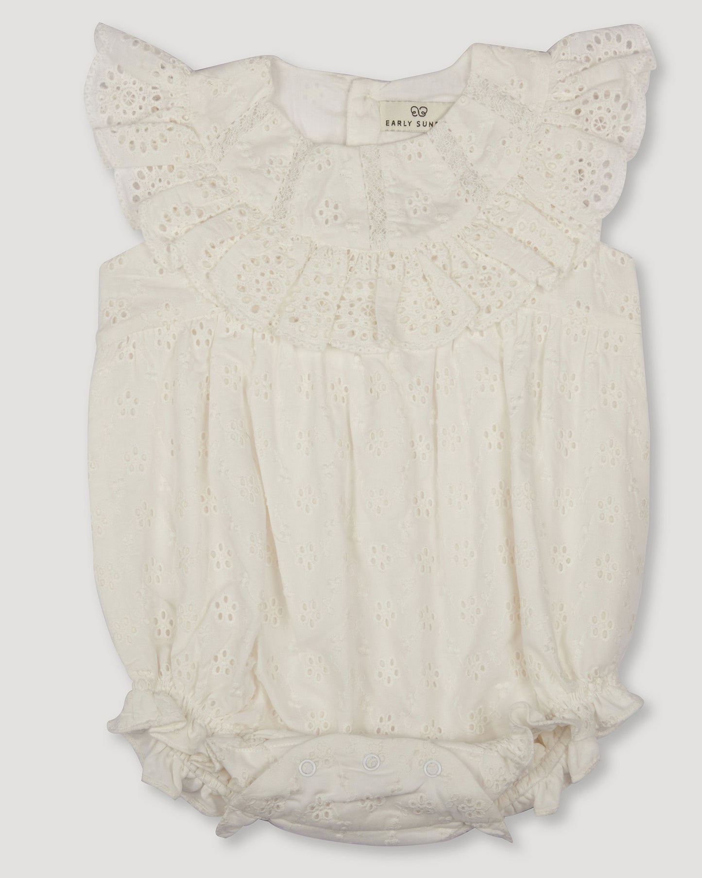 Early Sunday, Rose Baby Bubble Romper in Ivory color, made from All-Over Eyelet Embroidered Cotton Schifflie fabric, featuring gathered bubble silhouette for a cute and comfortable fit, with a relaxed design that allows for ease of movement, shown in a front flat-lay view