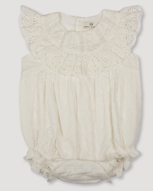 Early Sunday, Rose Baby Bubble Romper in Ivory color, made from All-Over Eyelet Embroidered Cotton Schifflie fabric, featuring gathered bubble silhouette for a cute and comfortable fit, with a relaxed design that allows for ease of movement, shown in a front flat-lay view