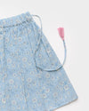 Early Sunday, Ruth Skirt in Tonal Floral Blue color, made from Printed Cotton Tiny Swiss Dobby fabric, featuring a flared silhouette with an elastic waistband & floral design, shown in a closeup flat-lay view