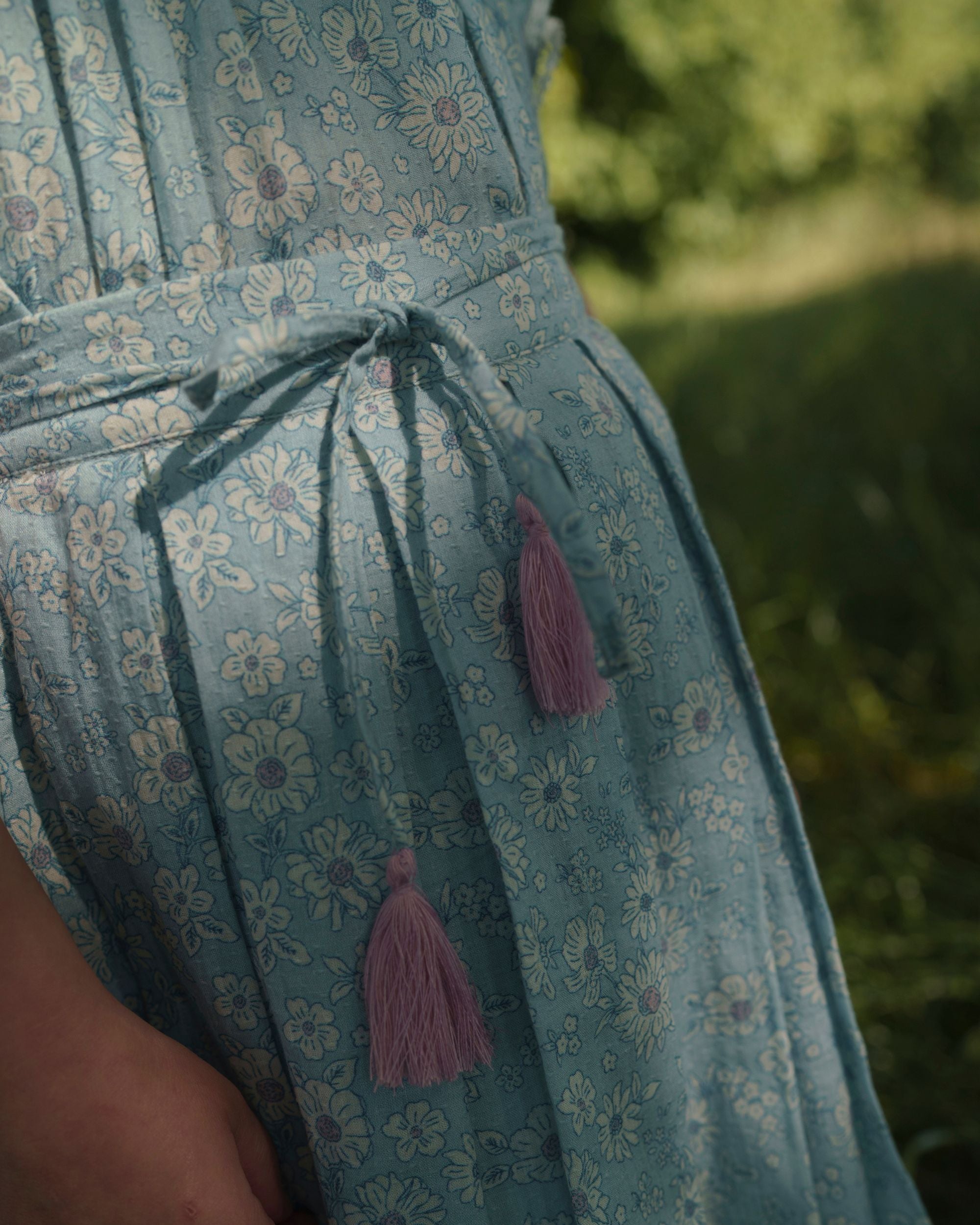 Early Sunday, Ruth Skirt in Tonal Floral Blue color, made from Printed Cotton Tiny Swiss Dobby fabric, featuring a flared silhouette with an elastic waistband & floral design, shown in a close-up shot of the print