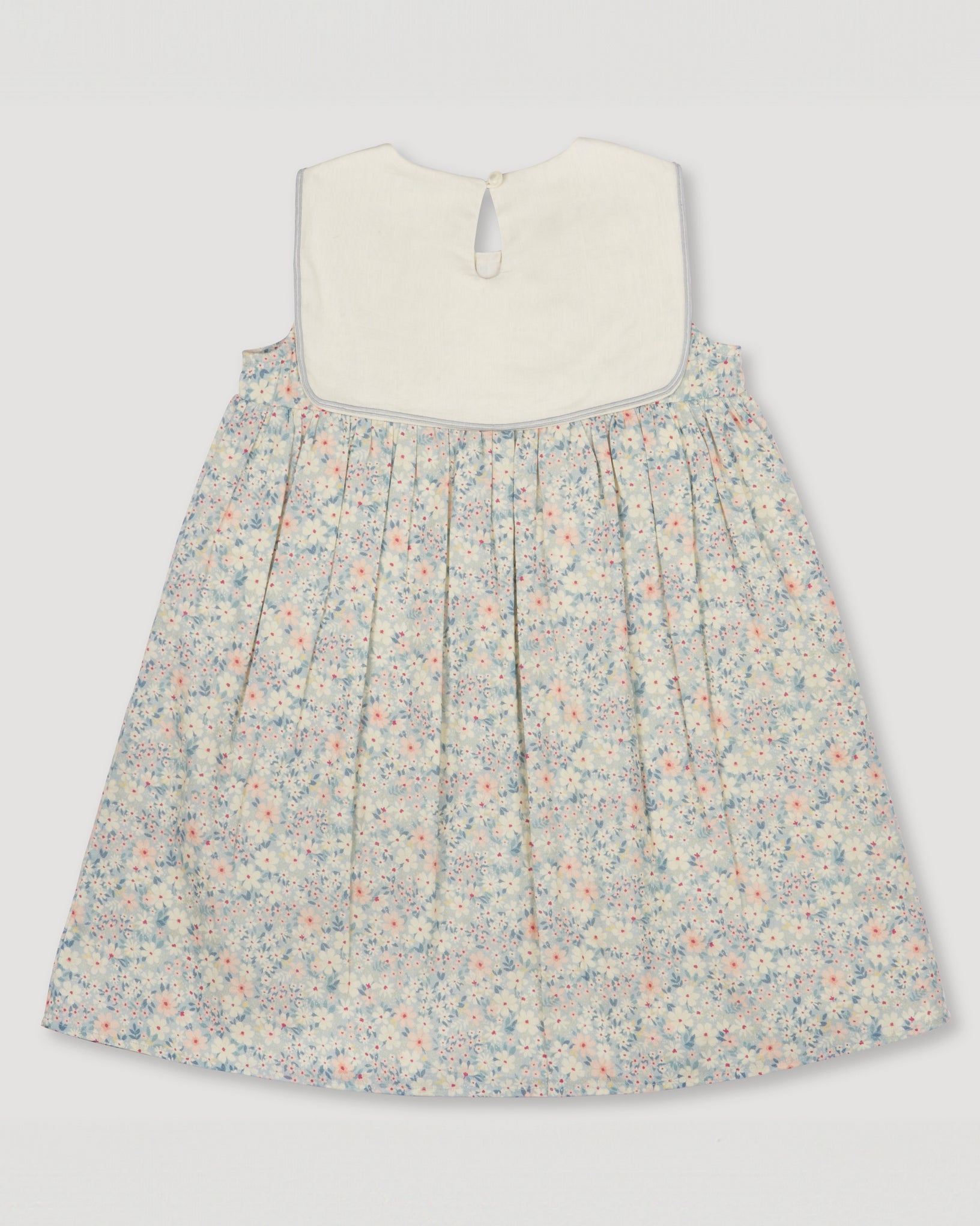 Early Sunday, Sabrina Dress in Amelia print, made from Printed Cotton Cambric fabric, featuring flattering fit with delicate finishes, combining style and functionality for an effortlessly elegant look, shown in a back flat lay view