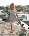 Early Sunday, Sabrina Dress in Amelia print, made from Printed Cotton Cambric fabric, featuring flattering fit with delicate finishes, combining style and functionality for an effortlessly elegant look, shown in a front view of model wearing it