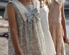 Early Sunday, Sabrina Dress in Amelia print, made from Printed Cotton Cambric fabric, featuring flattering fit with delicate finishes, combining style and functionality for an effortlessly elegant look, shown in a an angled view of a model wearing outdoors