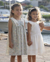 Early Sunday, Sabrina Dress in Amelia print, made from Printed Cotton Cambric fabric, featuring flattering fit with delicate finishes, combining style and functionality for an effortlessly elegant look, shown in a outdoor shot of models wearing  it