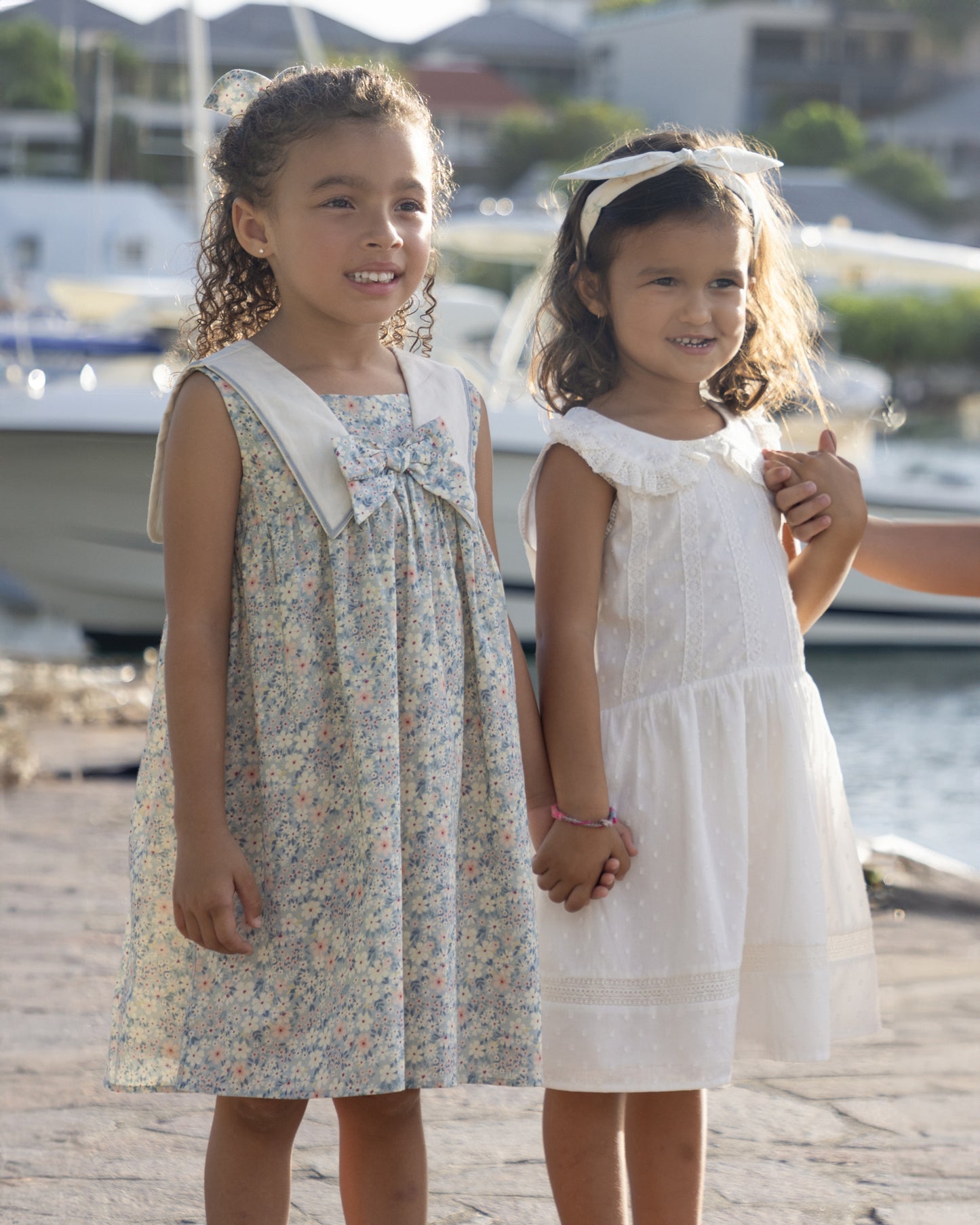 Early Sunday, Sabrina Dress in Amelia print, made from Printed Cotton Cambric fabric, featuring flattering fit with delicate finishes, combining style and functionality for an effortlessly elegant look, shown in a outdoor shot of models wearing  it