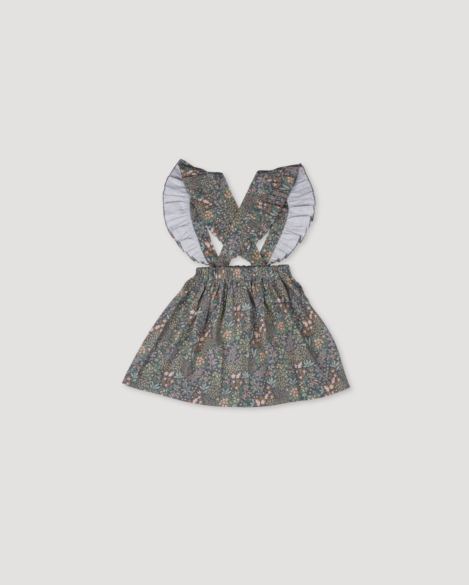 Early Sunday, Selma Skirt in Autumn Garden Greyish Blue, made from Printed Cotton Satin fabric, featuring dungaree style with adjustable straps, shown in a back flat-lay view