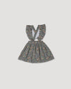Early Sunday, Selma Skirt in Autumn Garden Greyish Blue, made from Printed Cotton Satin fabric, featuring dungaree style with adjustable straps, shown in a front flat-lay view