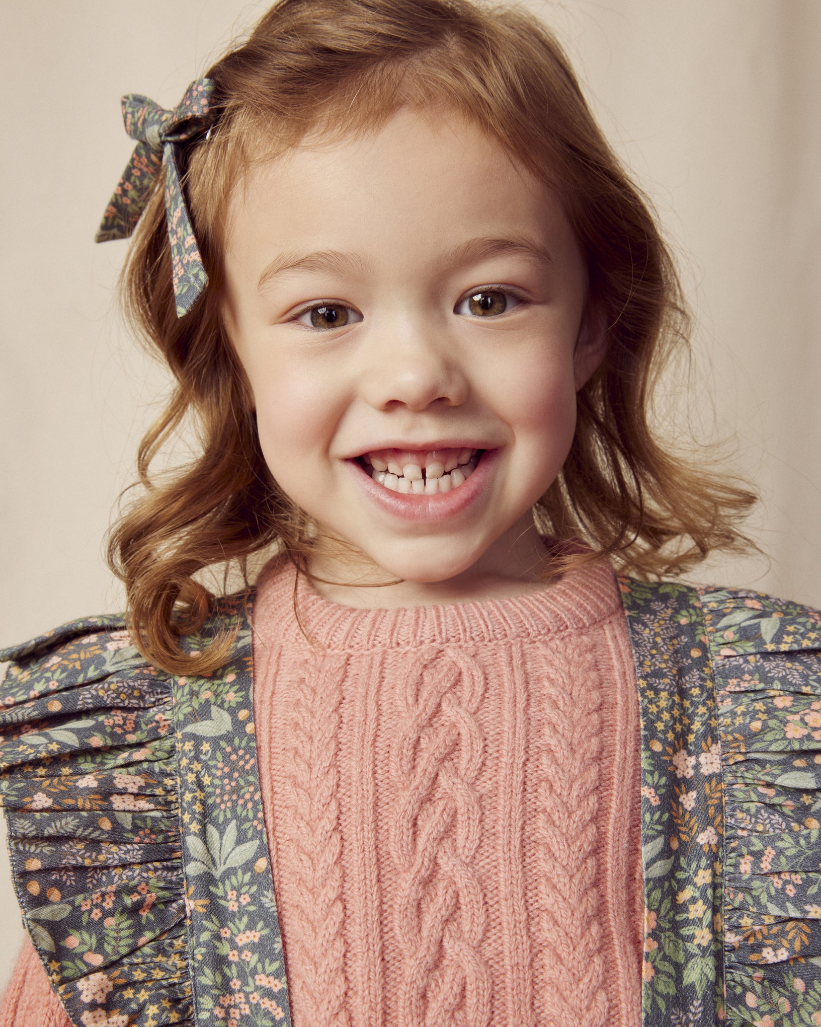 Early Sunday, Selma Skirt in Autumn Garden Greyish Blue, made from Printed Cotton Satin fabric, featuring dungaree style with adjustable straps, shown in a close-up shot of a model wearing it during a studio shoot