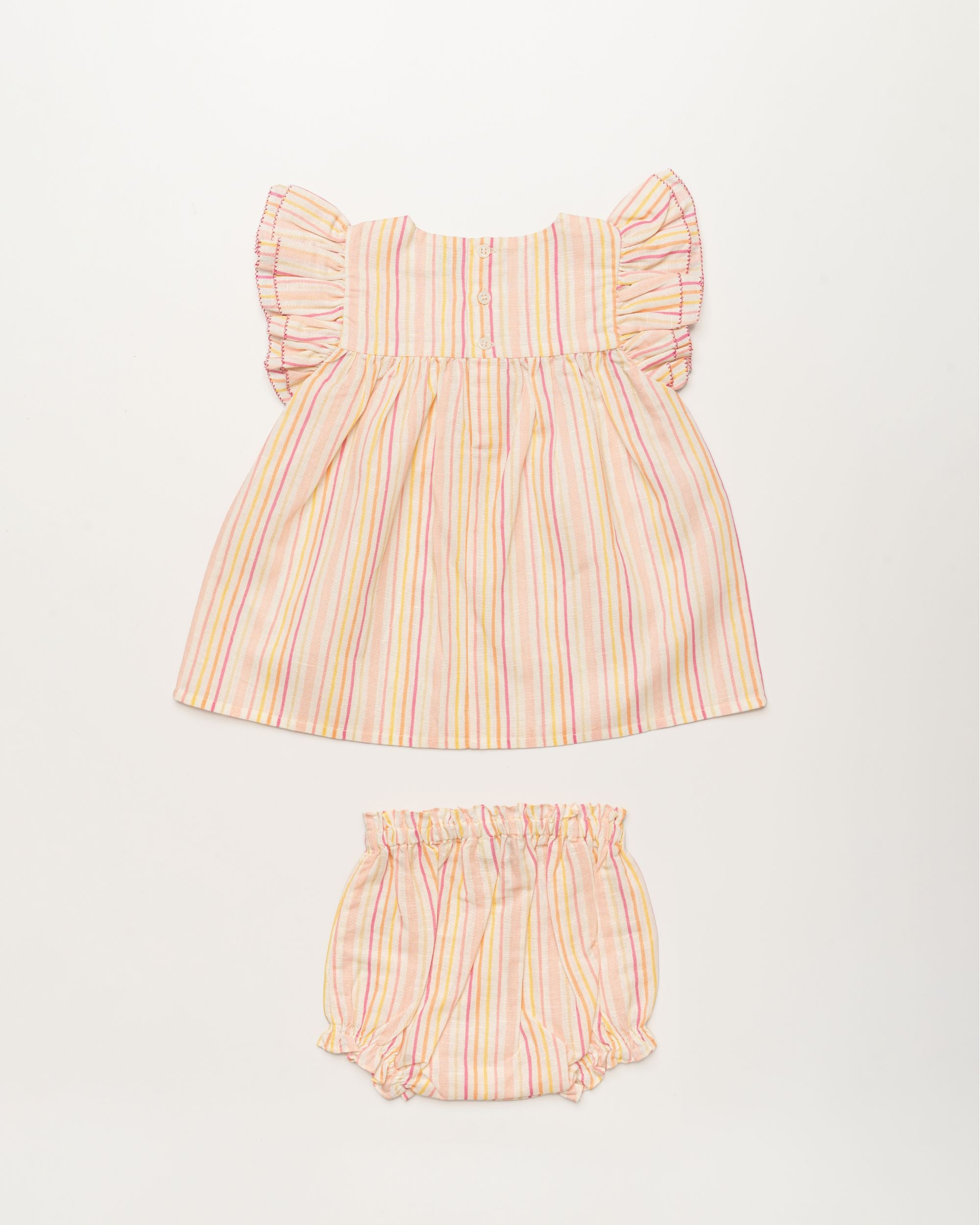 Early Sunday, Sienna Baby Dress & Bloomer Set in Pink Stripes print, made from 70% Cotton 30% Linen fabric, featuring a relaxed fit with smocked chest band & frilled sleeves, shown in a back flat-lay view