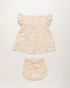 Early Sunday, Sienna Baby Dress & Bloomer Set in Painted Bouquet print, made from 70% Cotton 30% Linen fabric, featuring a relaxed fit with smocked chest band & frilled sleeves, shown in a back flat-lay view