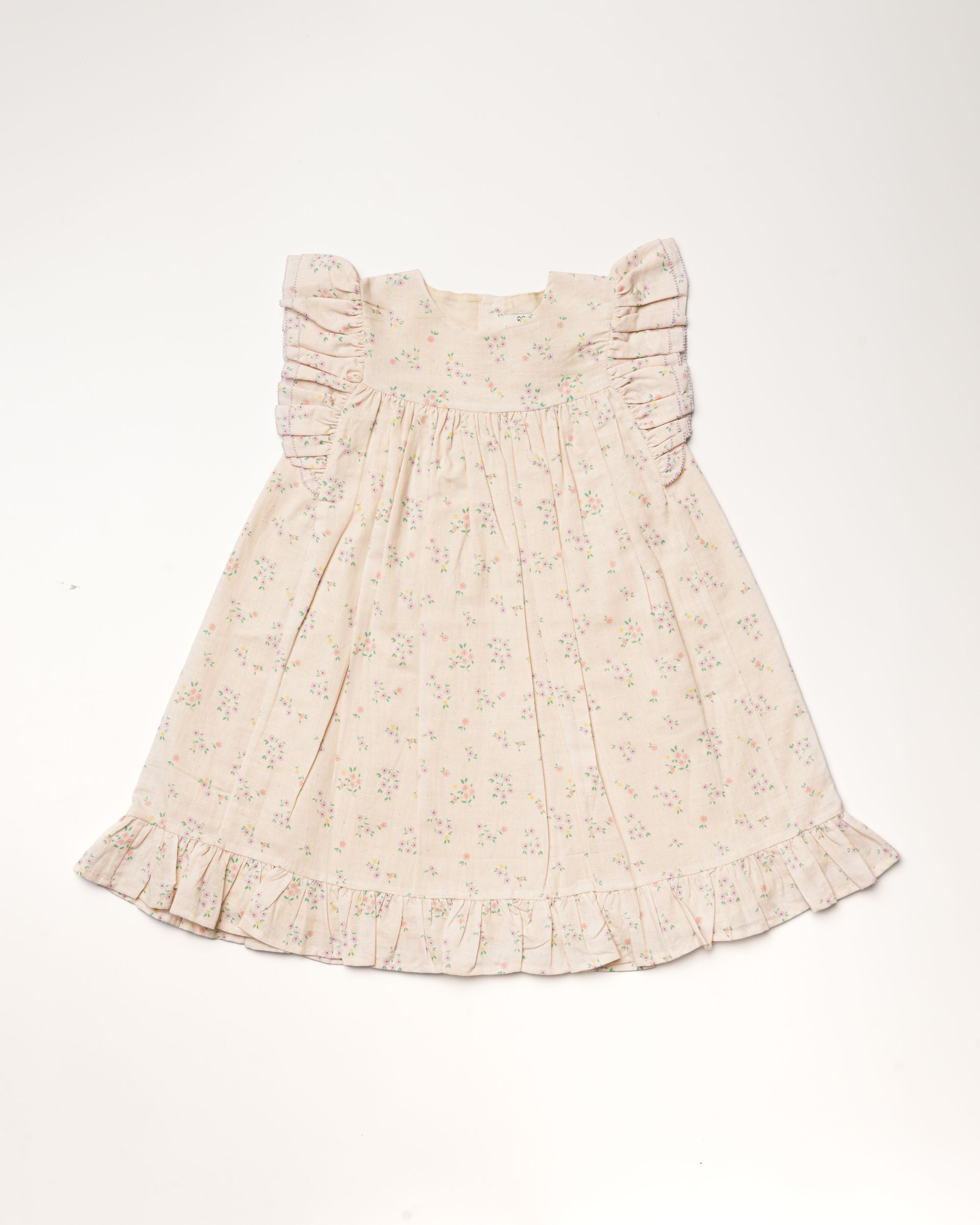 Early Sunday, Sita Dress in Painted Bouquet print, made from 70% Cotton 30% Linen fabric, featuring a sleeveless design with wide shoulder straps & a delicate lace yoke, shown in a front flat-lay view