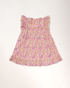 Early Sunday, Sita Dress in Emma Floral Purple color, made from Organic Printed Cotton Cambric fabric, featuring a sleeveless design with wide shoulder straps & a delicate lace yoke, shown in a back flat-lay view