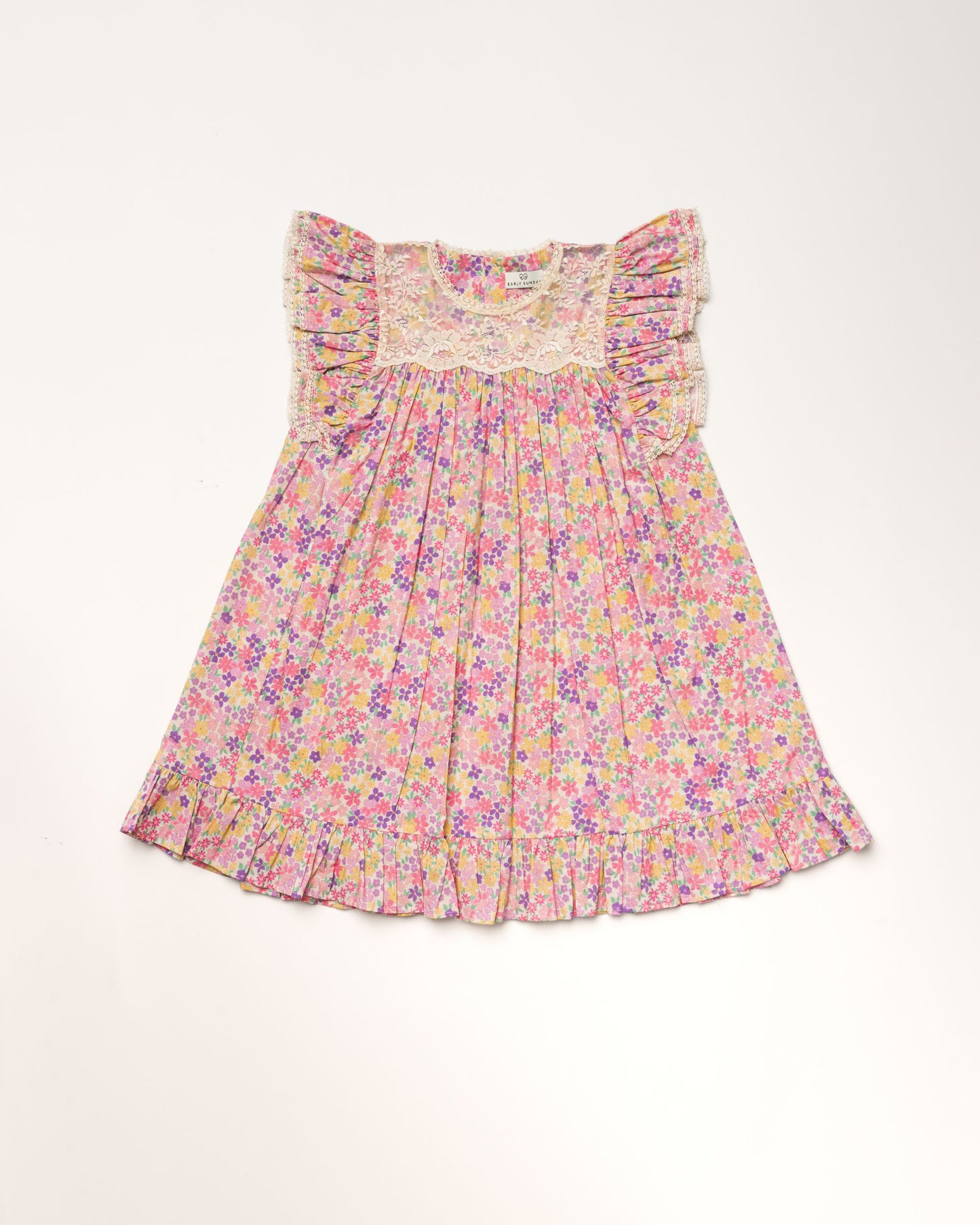 Early Sunday, Sita Dress in Emma Floral Purple color, made from Organic Printed Cotton Cambric fabric, featuring a sleeveless design with wide shoulder straps & a delicate lace yoke, shown in a front flat-lay view