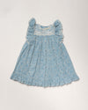 Early Sunday, Sita Dress in Tonal Floral Blue color, made from Printed Cotton Tiny Swiss Dobby fabric, featuring a sleeveless design with wide shoulder straps & a delicate lace yoke, shown in a front flat-lay view
